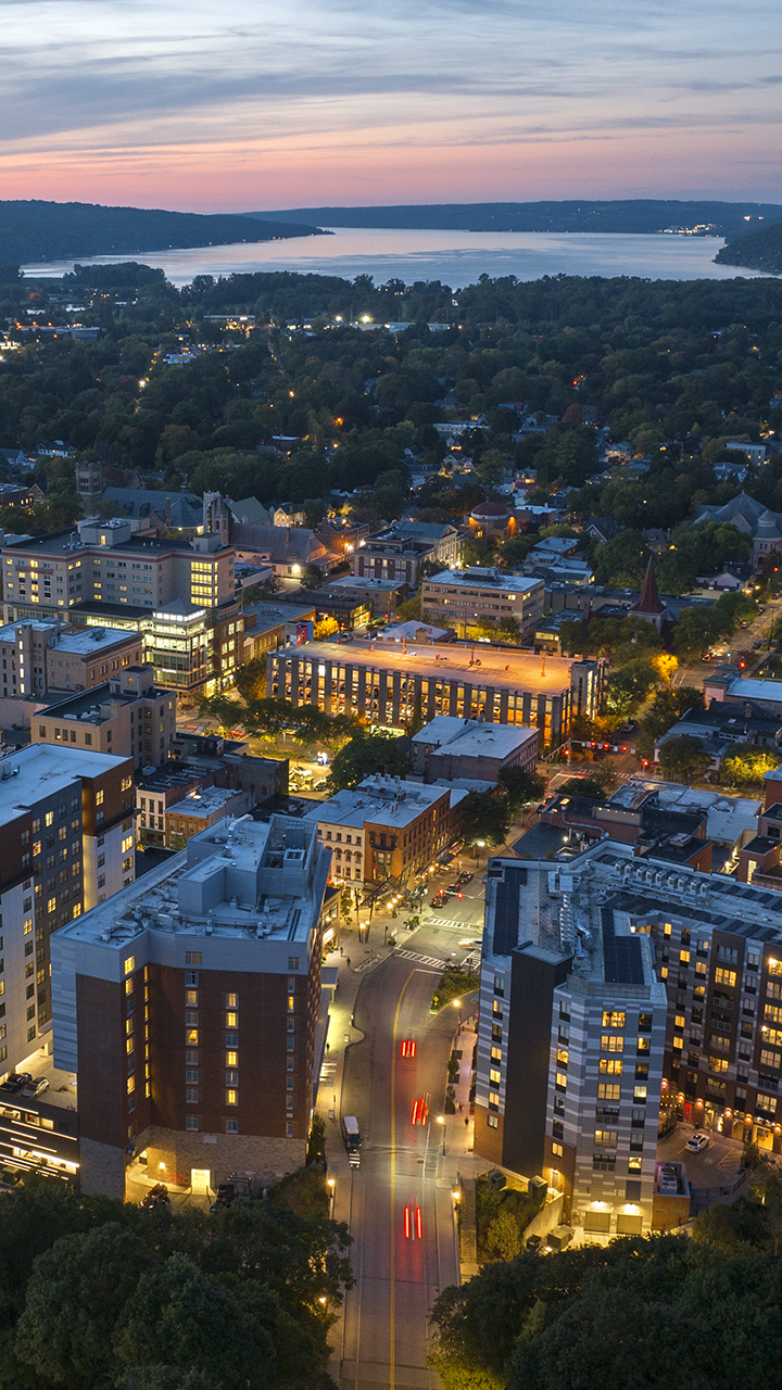 Aerial view of Downtown Ithaca and Cayuga Lake at sunset.