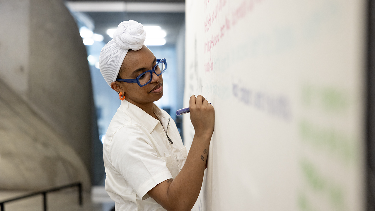 AAP student Milan Taylor works on her art installation.