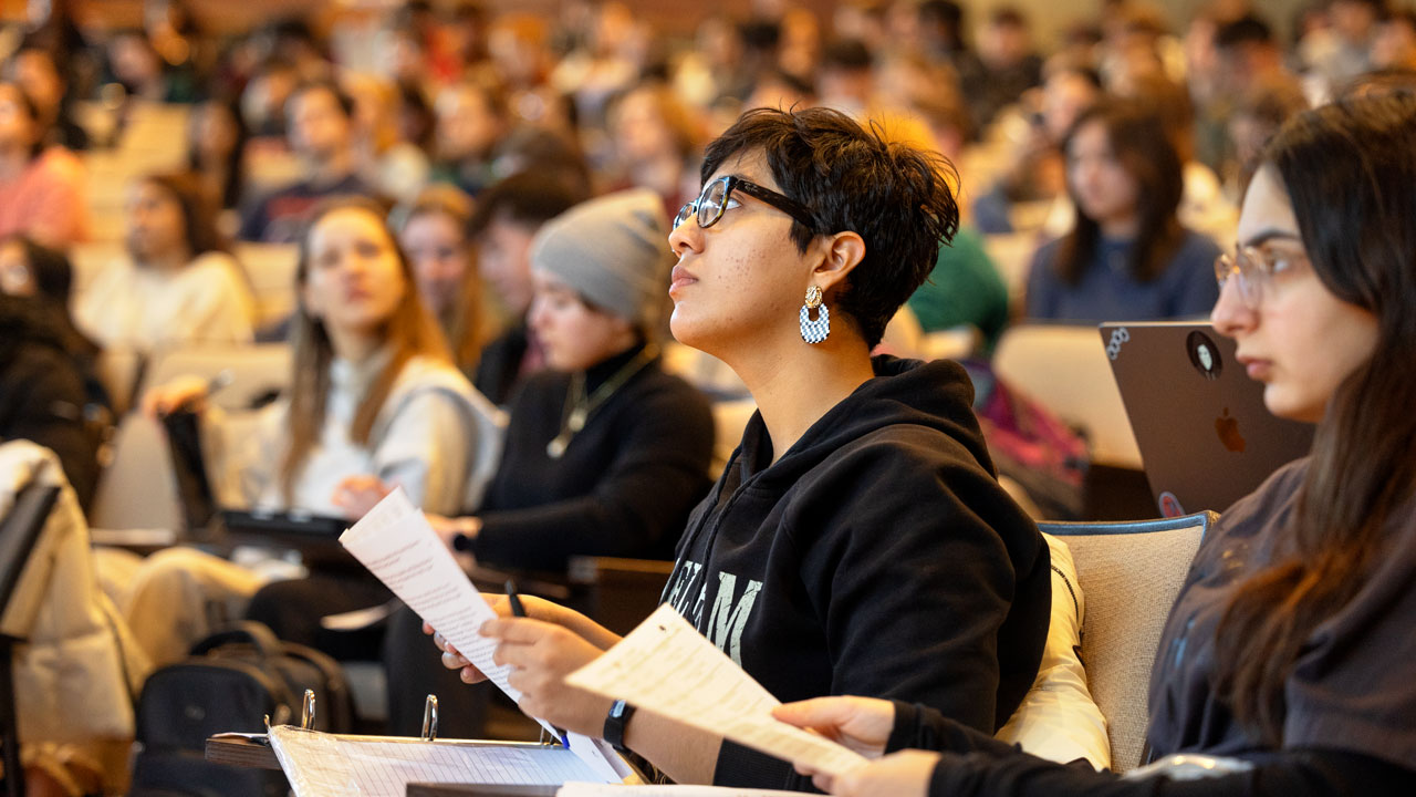 Students attend physics class in Rockefeller Hall.